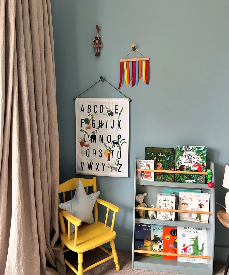 image of childrens room with chair, book shelf and breathe paint