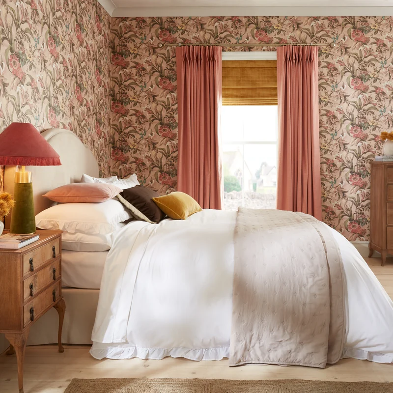 Lys Whispering Rose Wallpaper and Wallace Peach Curtains in a bedroom setting