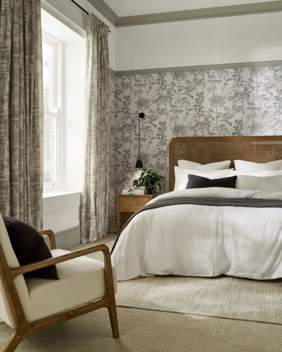 Reecho Neutral curtain coordinated with Esther Stone wallpaper in a bedroom setting