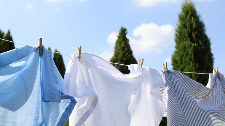 A shirt being hung up in the sun