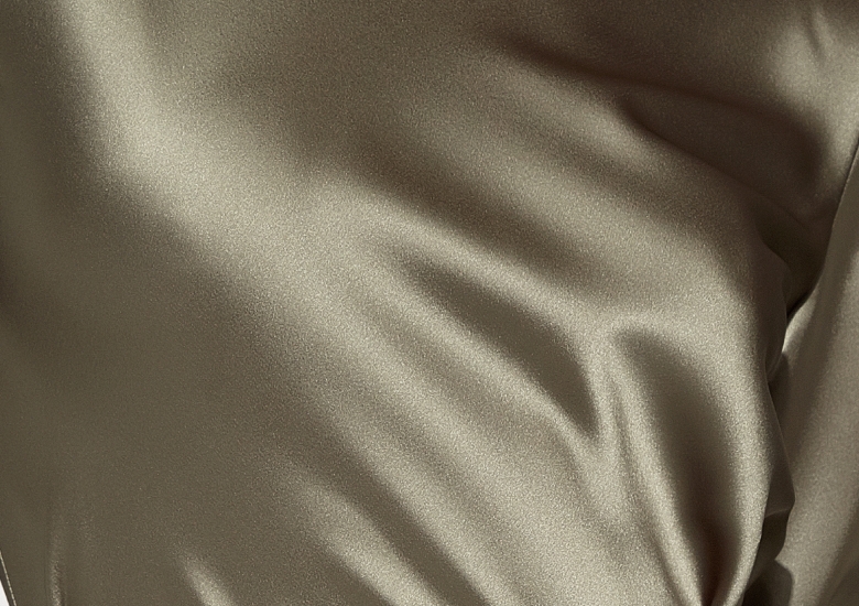 Zoomed in photo of silk material, such as a silk dress