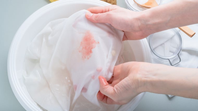 Tomato sauce stained clothes in a laundry basket