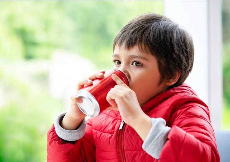 child drinking soft drink