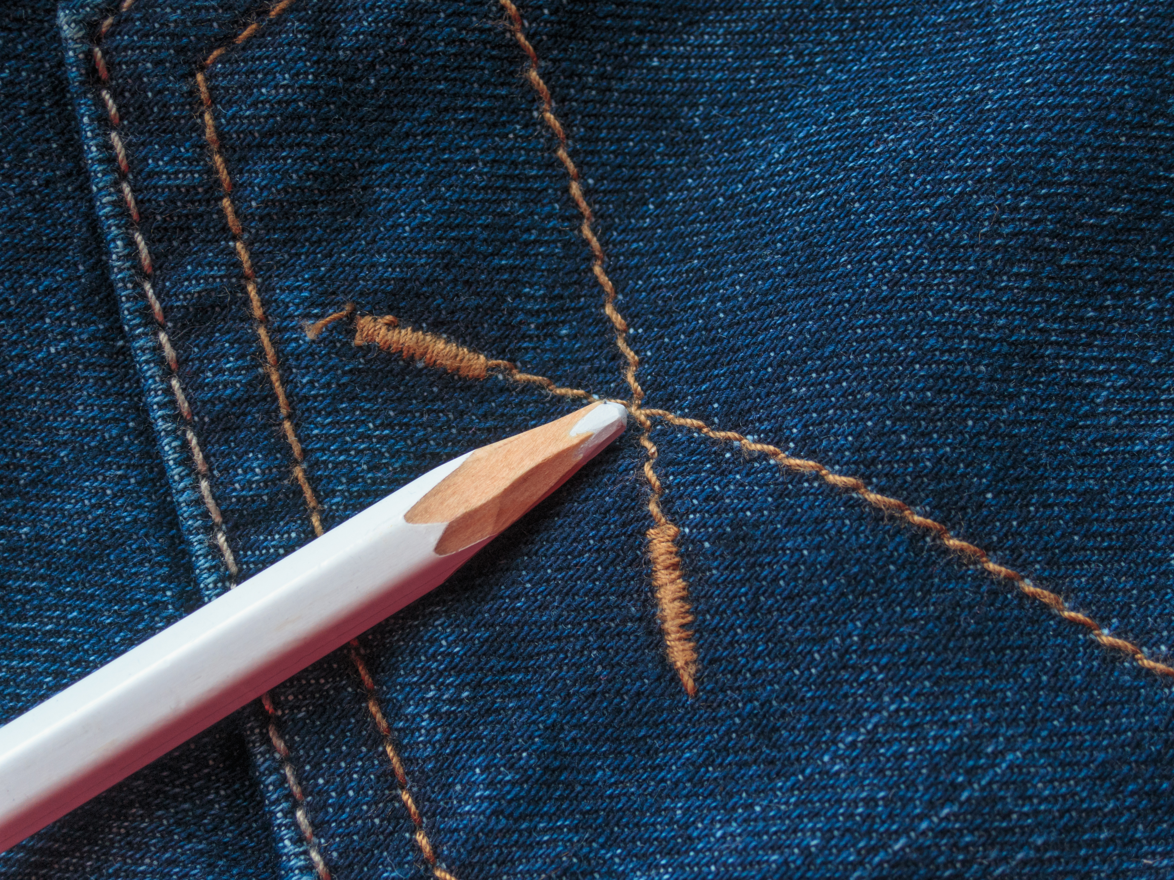 remove pencil marks from clothes