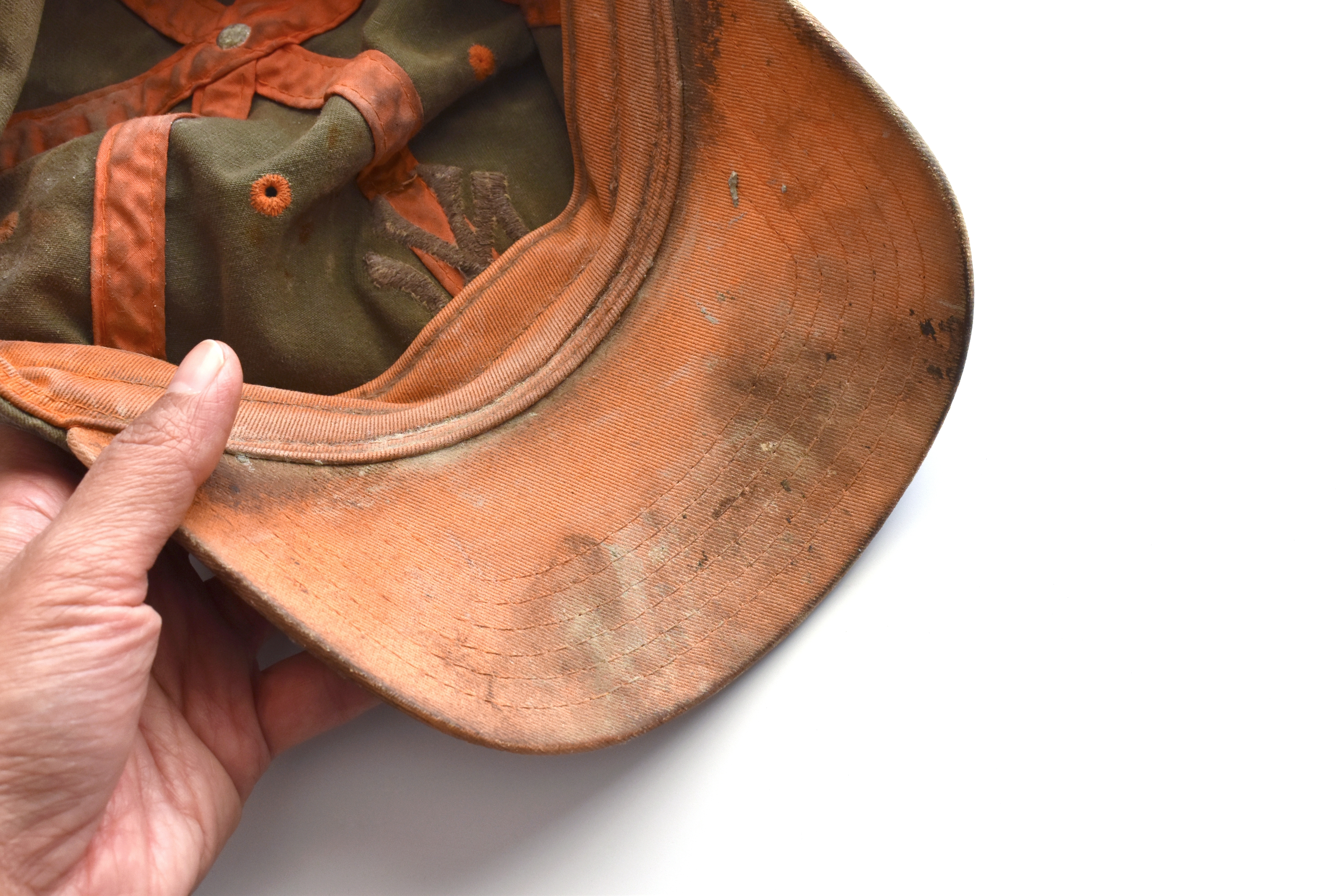 Removing sweat stains from caps