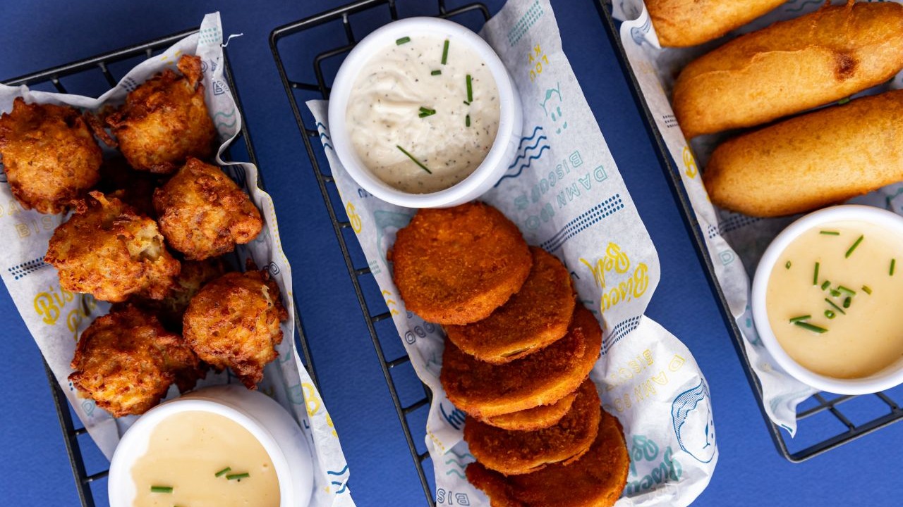 Biscuit Belly's menu includes Loaded Breakfast Tots, Fried Green Tomatoes, and Pancake Corndogs