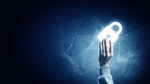 A hand holding a glowing digital padlock A hand holding a glowing digital padlock