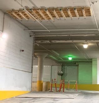 Suspended formwork above interior vehicle-access ramps