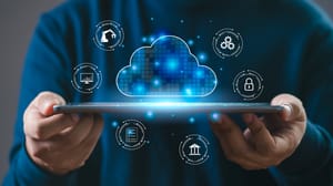 A person holds a tablet displaying a glowing cloud icon with digital symbols around it, representing data security technology concepts. A person holds a tablet displaying a glowing cloud icon with digital symbols around it, representing data security technology concepts.