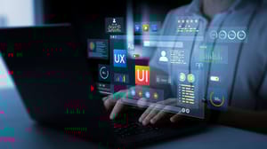 An image of a person at a laptop with website analytic icons around it An image of a person at a laptop with website analytic icons around it