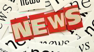 The word news with red letters on top of newspaper clips of the word news The word news with red letters on top of newspaper clips of the word news