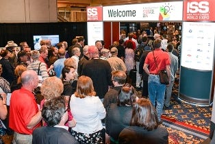Attendees rush into the exhibit hall at this year's ISS Expo, where more than 125 companies demonstrated their products and services. 