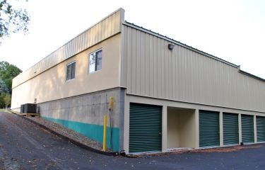 This facility in Naugatuck, Conn., features a two-story-into-a-hill design, allowing access to both levels with no need for a costly elevator. These buildings create greater rentable area on heavily sloped parcels.
