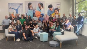 A group of people posing for a photo A group of people posing for a photo