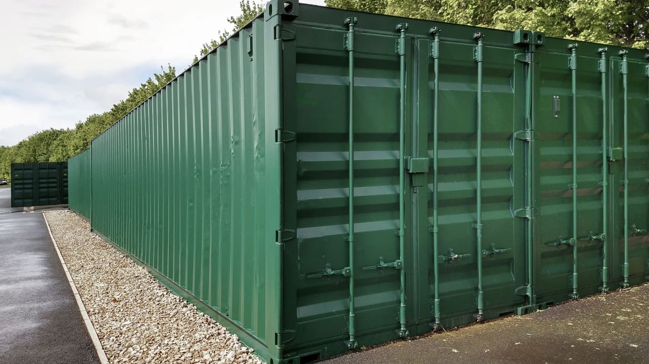 An image of a row of green container storage units An image of a row of green container storage units