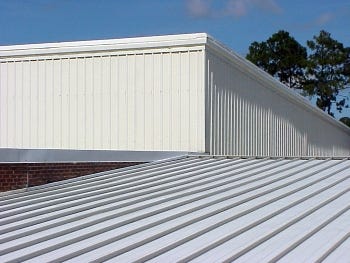 A light-colored metal-panel roof system is reflective to reduce heat gain. Concealed clips and fasteners are used to allow thermal expansion and contraction and eliminate exposed fasteners that may become a maintenance concern.