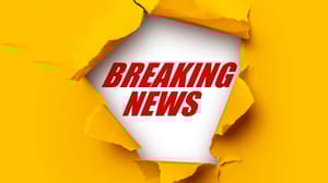 An image of the words breaking news coming though orange-yellow construction paper. An image of the words breaking news coming though orange-yellow construction paper.