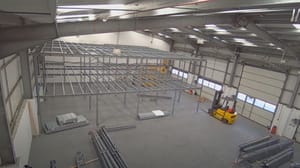 A video still of a WCL Storage Systems converting a warehouse to self-storage using a mezzanine system. A video still of a WCL Storage Systems converting a warehouse to self-storage using a mezzanine system.