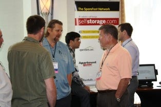Jack Murphy of Murphy's U-Store-It in Dunlap, Ill., and Call Potential speaks with fellow exhibitors.