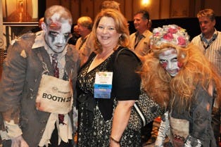 Storage.com zombies pose with and ISS Expo attendee on the show floor.