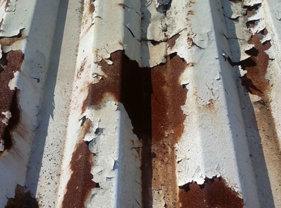 An example of severe rusting on a metal roof panel