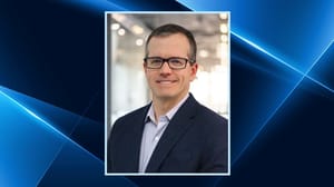 A man wearing glasses and smiling A man wearing glasses and smiling