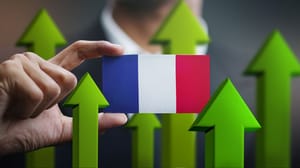 Two fingers holding a mini France flag surrounded by green arrows pointing up Two fingers holding a mini France flag surrounded by green arrows pointing up