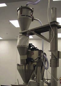 Material is conveyed to vacuum receivers until reaching pre-determined loads and then discharge from below.