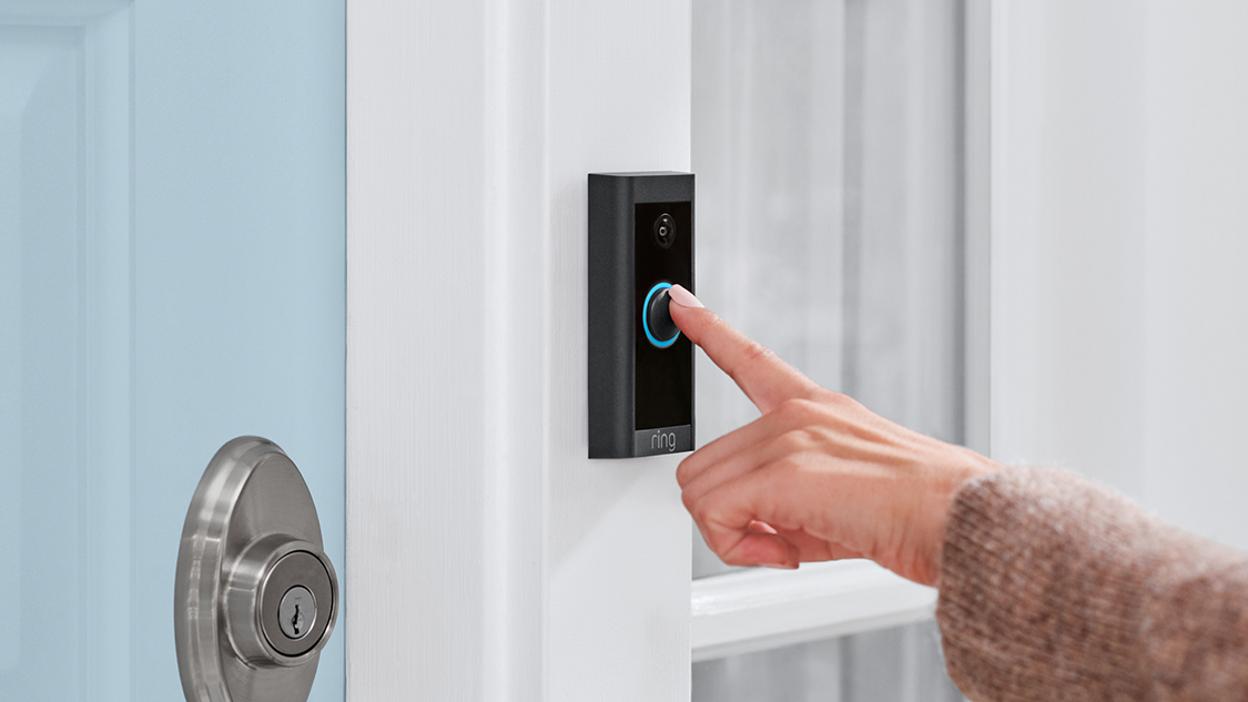 Visitor_pressing_Video_Doorbell_Wired_ding_button.png