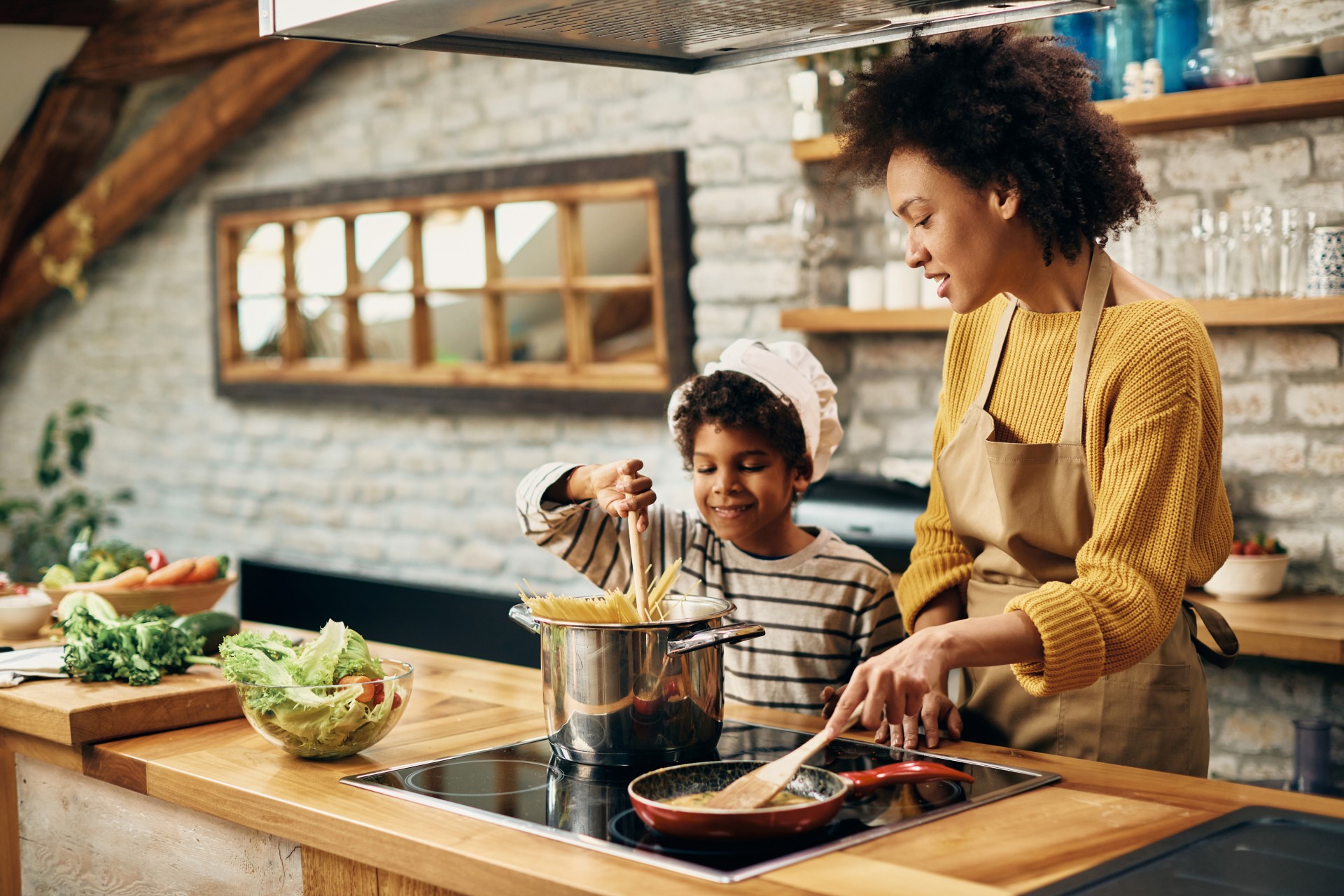 african-american-mother-son-cooking-together-kitchen.jpg