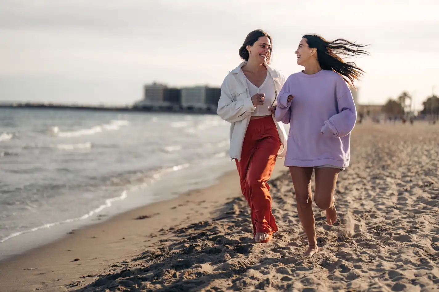 girls running in the beach