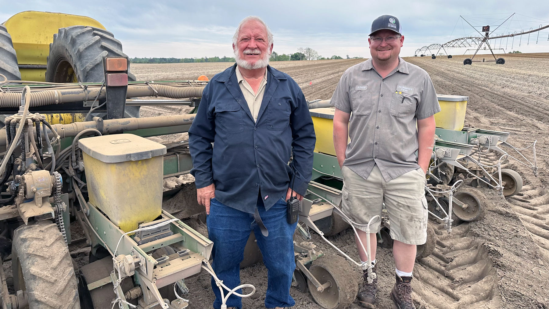 Joe and Knapp Boddiford beside corn planter.