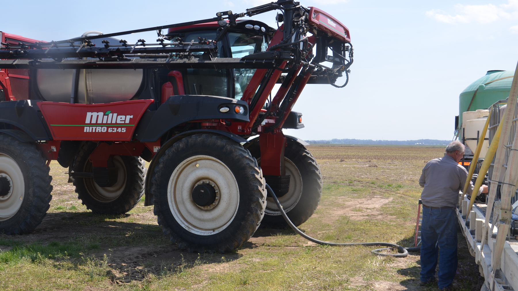 farmer filling a sprayer