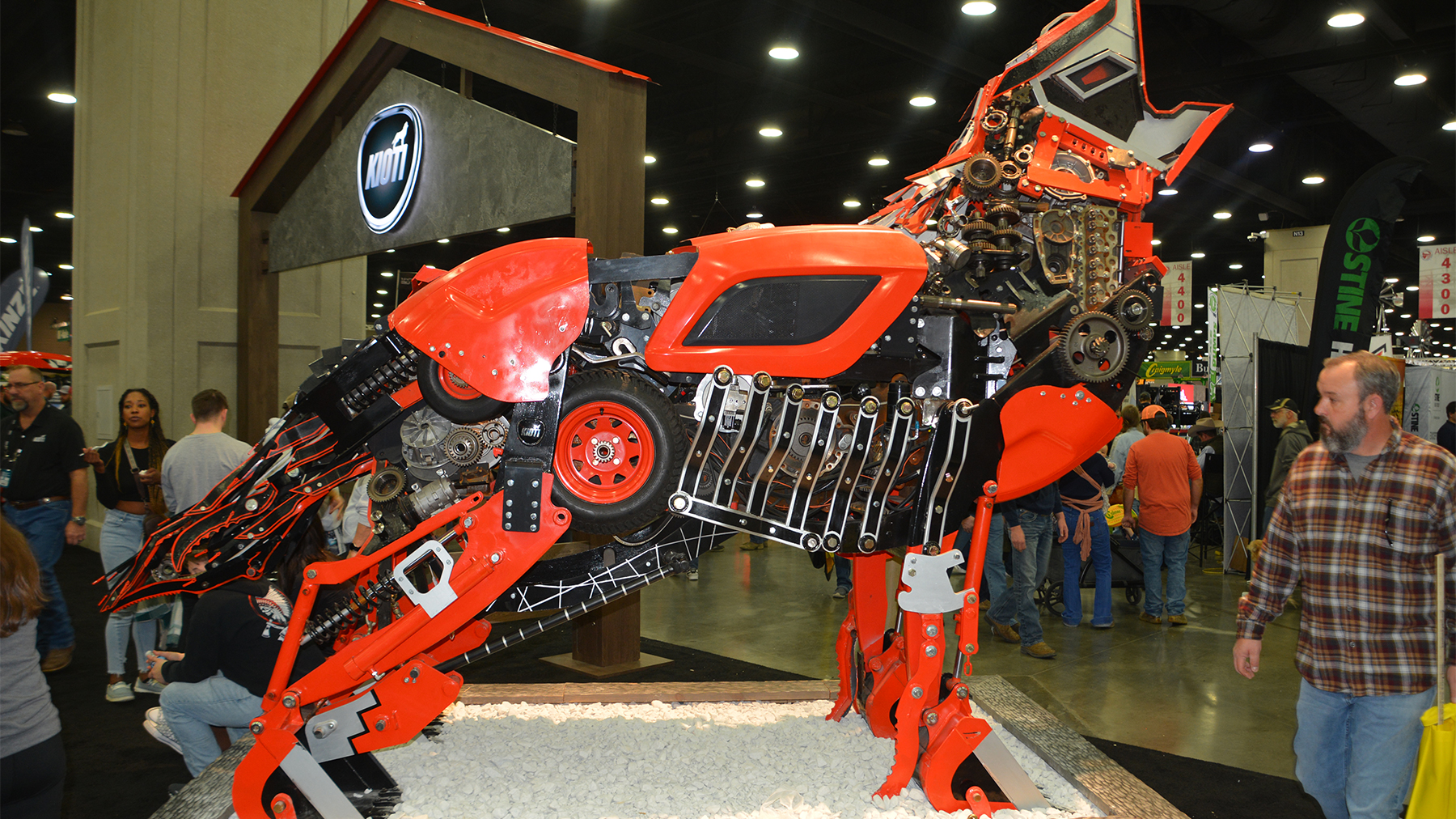 A statue of a coyote made out of machinery parts at the Kioti display at National Farm Machinery Show