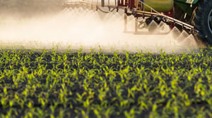 Tractor spraying a field Tractor spraying a field
